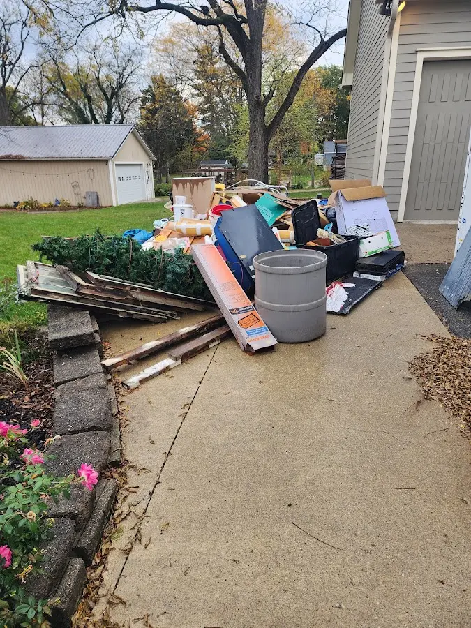 Dumpster being loaded with debris for 3 Yard Dumpster Rental in Broadview Park